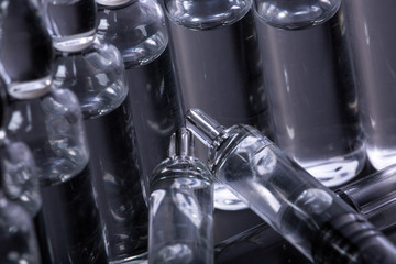  medical ampoules on a black background