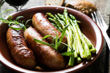Grilled sausage with asparagus and rosemary