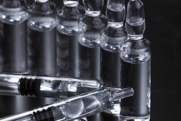  medical ampoules on a black background