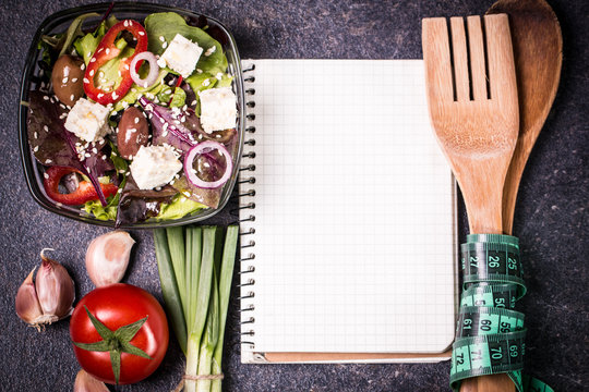 Diet concept, salad ingredients on black background . healthy food