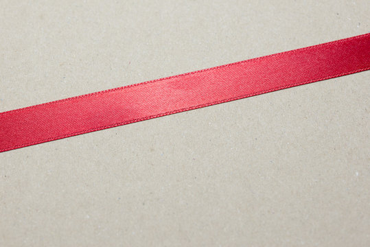 red ribbon or red strip with the brown background