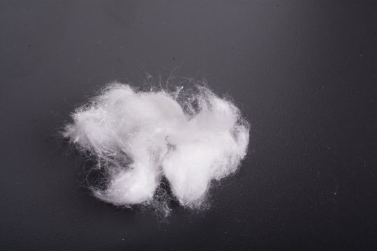 Cotton White Ball Against A Dark Background