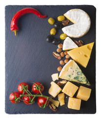 Different varieties of cheese on a black board