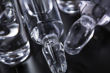  medical ampoules on a black background