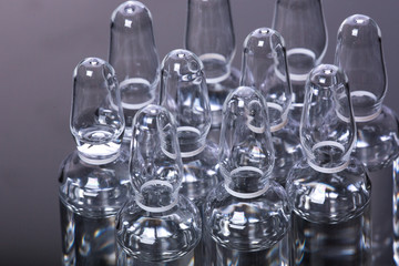  medical ampoules on a black background