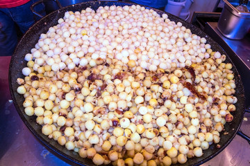 Fried potatoes with bacon - traditional german dish on Christmas market