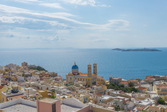 Imposive church among traditional neoclassical houses by the sea
