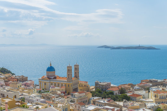 Imposive church among traditional neoclassical houses by the sea