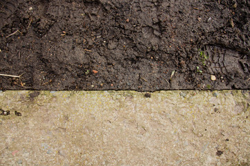 Mound construction.  Soil background. Park ground texture with rocks mulch and dirt. Black soil texture. fine texture of brown gravel on a dirt road
