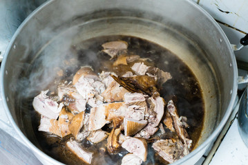 Duck stewed with gravy in hot stainless pot ready for make a sacrifice to gods on Chinese new year day