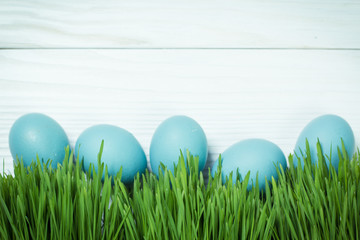 Easter concept with colored eggs on wooden background