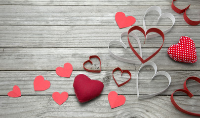 Assorted hearts on a wood background