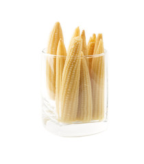 mini corn is in a glass