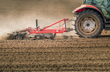 Tractor preparing land