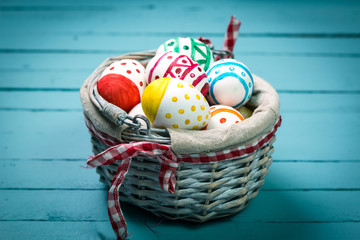 Easter concept with colorful eggs on wooden background
