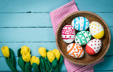 Easter concept with colorful eggs on wooden background