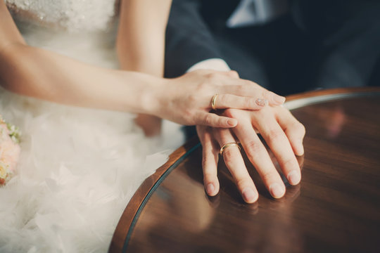 Wedding couple hands with rings closeup