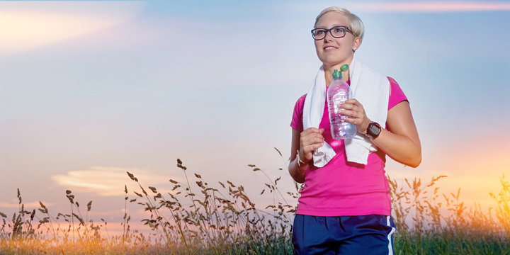 Young Woman standing proud after Jogging