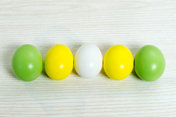 Colored easter eggs on wood