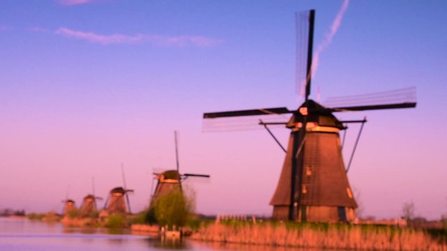 The picturesque landscape with aerial mills on the channel in Kinderdiyk, Netherlands at sunset. Full HD video. (relaxation, meditation, stress reduction - concept)