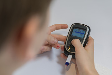 Boy measure glucose or blood suger level
