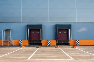 Printed roller blinds Industrial building Cargo doors at big industrial warehouse building