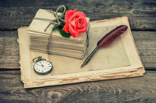 Love letters and pink rose flower. Vintage toned picture