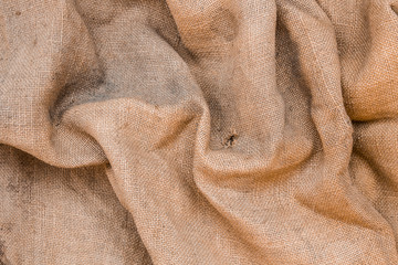 Wrinkled old jute fabric background