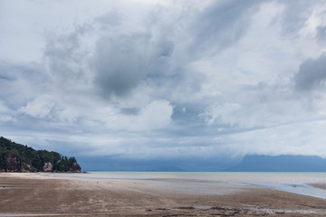 Deserted beach and stormy sky