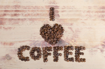 Inscription made from coffee beans says I love coffee. 