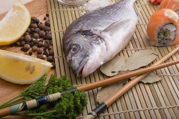 fresh fish with lemon, butter, salt and pepper