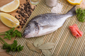  fresh fish with lemon, butter, salt and pepper