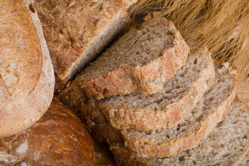 f bread with cereals on a fabric background brown color.
