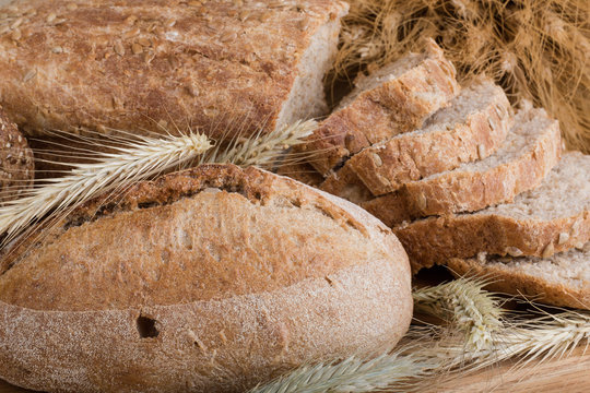 f bread with cereals on a fabric background brown color.
