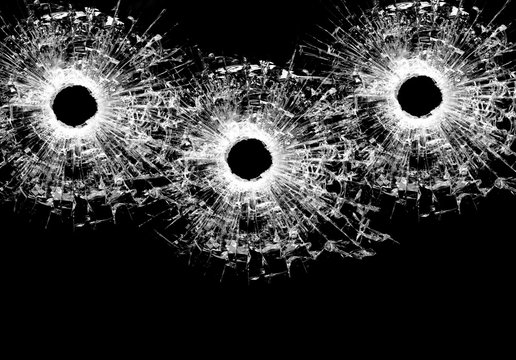 Bullet holes on black