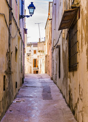 Fototapeta na wymiar View of a old nostalgic mediterranean narrow alleyway