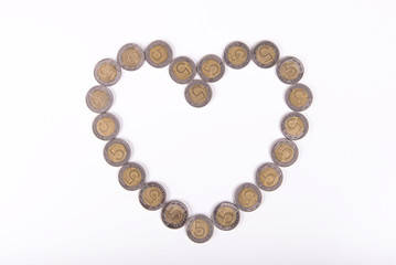 Money in the shape of heart. 