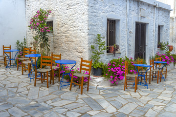 Fototapeta na wymiar Traditional greek tavern in the narrow streets of Mykonos, Greec