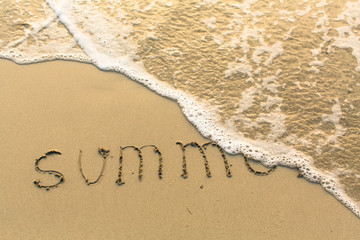 Fototapeta premium Summer - inscription on sand beach with the soft wave.