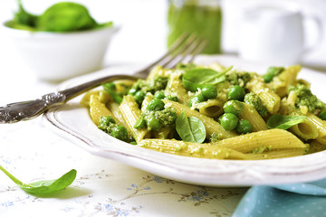 Penne with spinach pesto and green pea.
