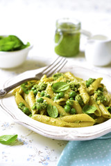 Penne with spinach pesto and green pea.
