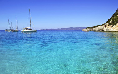 Naklejka na ściany i meble sailboats in turquoise sea of Ithaca Ionian islands Greece