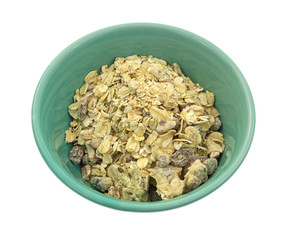 Maple flavored oatmeal with pecans and raisins in a green bowl on a white background