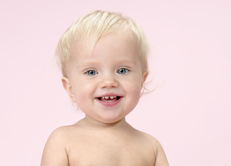little child baby portrait on pink background