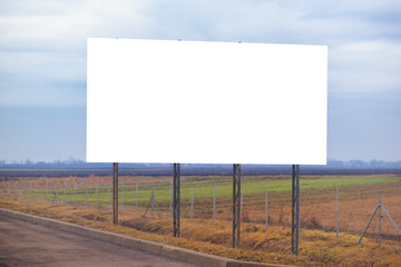 Blank billboard hoarding by the roadway
