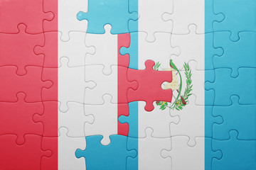 puzzle with the national flag of guatemala and peru