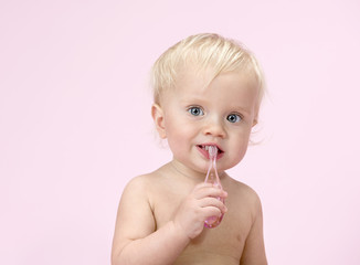 little child baby brushink teeth