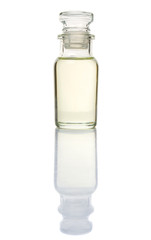 Corn vegetable cooking oil in vial glass over white background