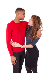 Happy mixed race couple hugging over a white background