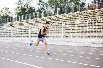 Man running on a racing track